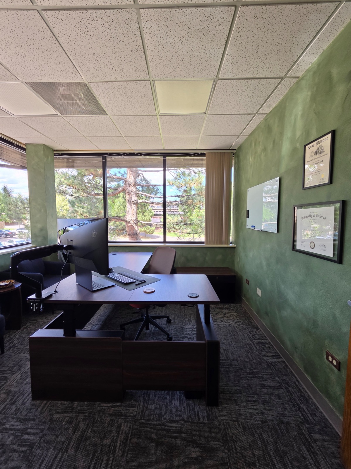 Dr. Wagner's office at Fortifying Wellness with framed Penn Medicine and University of Colorado diplomas